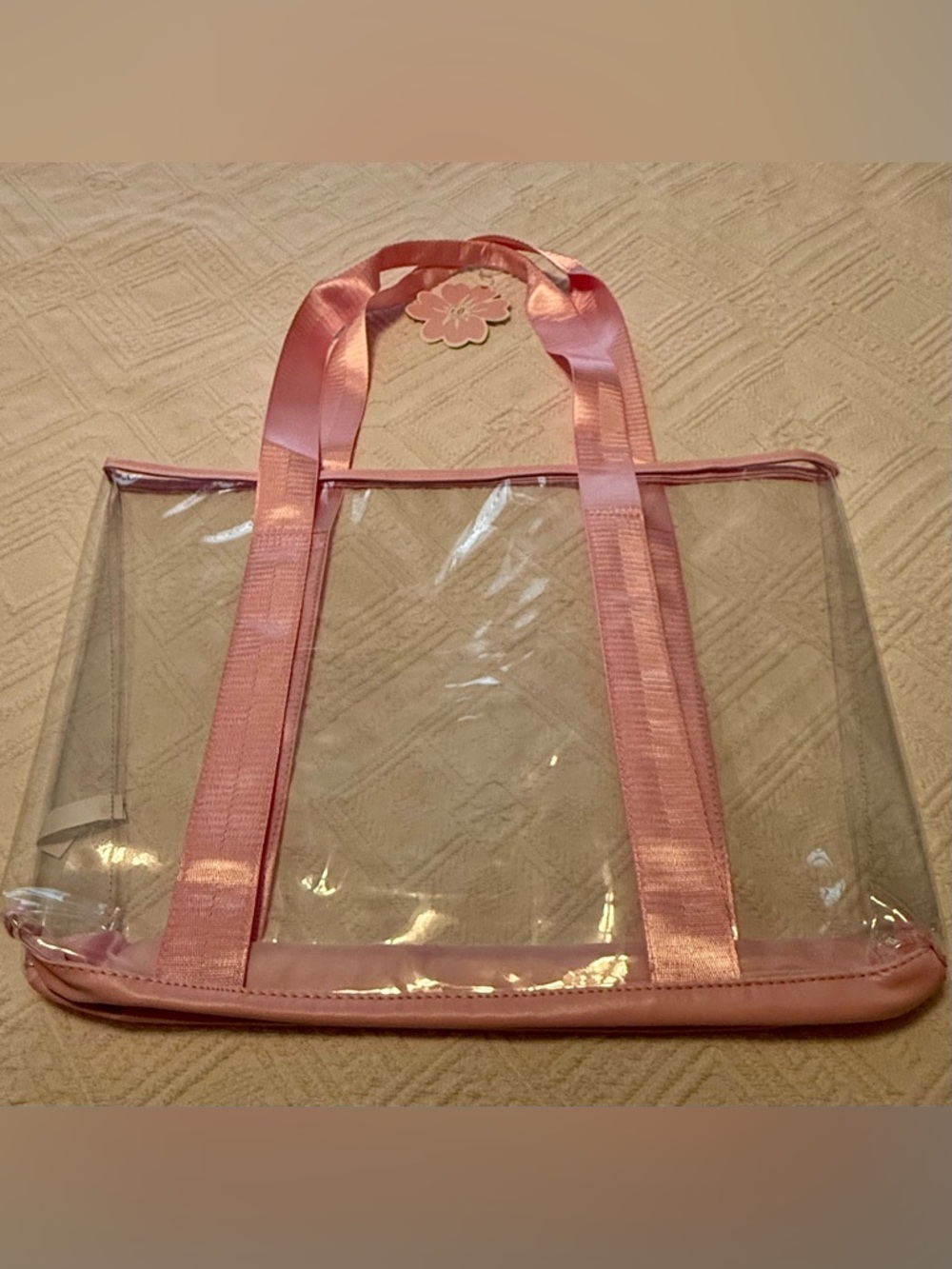 Tote bag - clear w/pink handles straps. 19x14x3. New w/tags. No flaws.